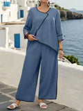 Set da 2 pezzi con blusa dal colletto asimmetrico e contrasto di colori, pantaloni con orlo spaccato