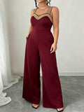 Tuta elegante oversize con spalline a spaghetti, decorazione in perline dorate su spalline e busto, tasche, pantaloni a gamba larga