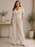 Completo da donna con blazer a manica 3/4 con design plissettato, monopetto, e pantaloni a gamba ampia